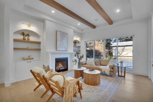 20 Roselake Street Nw, Calgary, AB - Indoor Photo Showing Living Room With Fireplace