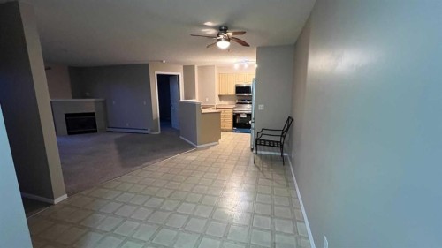 1208-12 Cimarron Common, Okotoks, AB - Indoor With Fireplace