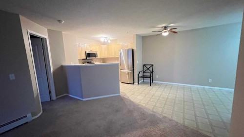 1208-12 Cimarron Common, Okotoks, AB - Indoor Photo Showing Kitchen