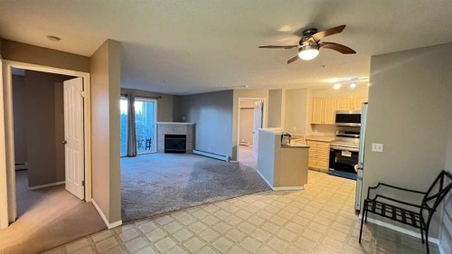1208-12 Cimarron Common, Okotoks, AB - Indoor With Fireplace