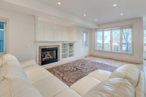 1410 26A Street Sw, Calgary, AB - Indoor Photo Showing Living Room With Fireplace