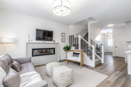 546 Rivercrest View, Cochrane, AB - Indoor Photo Showing Living Room With Fireplace