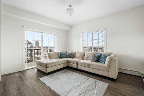 1411-99 Copperstone Park Se, Calgary, AB - Indoor Photo Showing Living Room