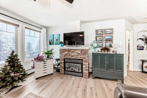 107-345 Rocky Vista Park Nw, Calgary, AB - Indoor Photo Showing Living Room With Fireplace