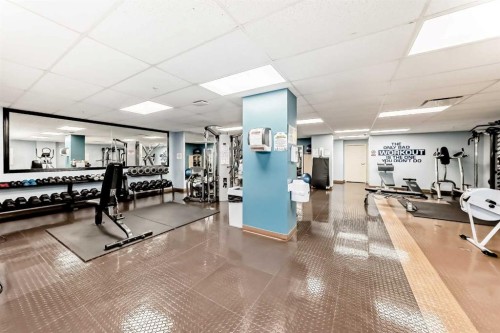 107-345 Rocky Vista Park Nw, Calgary, AB - Indoor Photo Showing Gym Room
