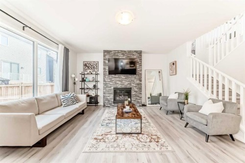 257 Carrington Way Nw, Calgary, AB - Indoor Photo Showing Living Room With Fireplace