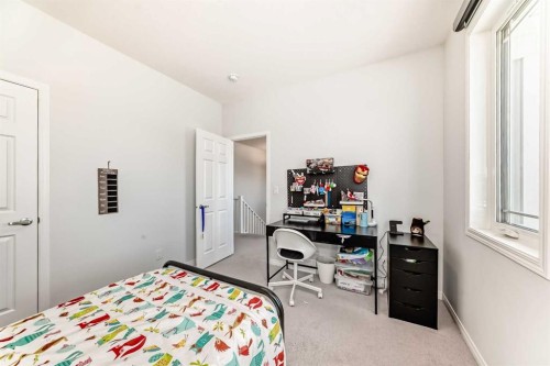 257 Carrington Way Nw, Calgary, AB - Indoor Photo Showing Bedroom