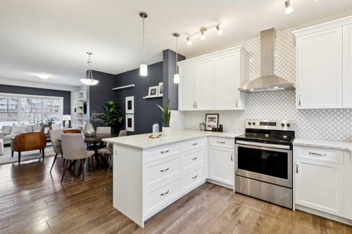 98 Magnolia Square Se, Calgary, AB - Indoor Photo Showing Kitchen With Upgraded Kitchen