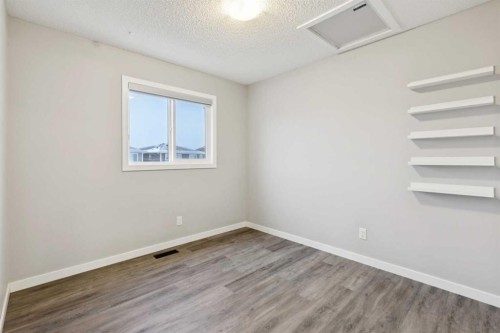 98 Magnolia Square Se, Calgary, AB - Indoor Photo Showing Other Room
