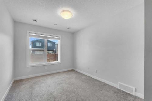 34 Sage Bluff Heights Nw, Calgary, AB - Indoor Photo Showing Other Room