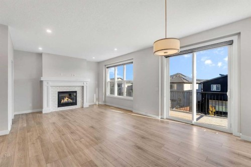 34 Sage Bluff Heights Nw, Calgary, AB - Indoor Photo Showing Living Room With Fireplace