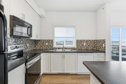 2406-279 Copperpond Common Se, Calgary, AB - Indoor Photo Showing Kitchen With Double Sink With Upgraded Kitchen