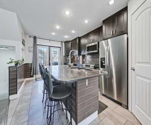 7 Prestwick Crescent Se, Calgary, AB - Indoor Photo Showing Kitchen With Double Sink With Upgraded Kitchen