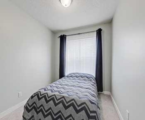 7 Prestwick Crescent Se, Calgary, AB - Indoor Photo Showing Bedroom