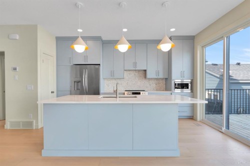 92 Fireside Common, Cochrane, AB - Indoor Photo Showing Kitchen With Upgraded Kitchen