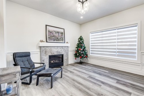 714 Mandalay Link, Carstairs, AB - Indoor Photo Showing Living Room With Fireplace