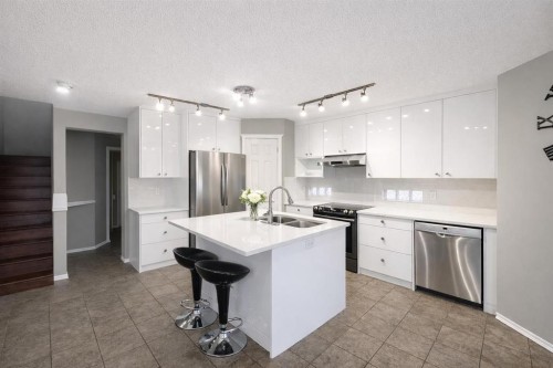 119 Country Hills Heights Nw, Calgary, AB - Indoor Photo Showing Kitchen With Double Sink With Upgraded Kitchen