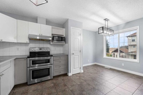 118 Copperfield Lane Se, Calgary, AB - Indoor Photo Showing Kitchen