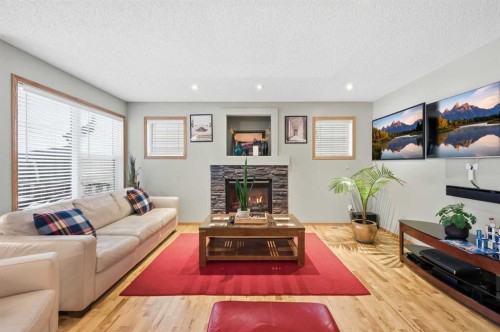 52 Panatella Gate, Calgary, AB - Indoor Photo Showing Living Room With Fireplace