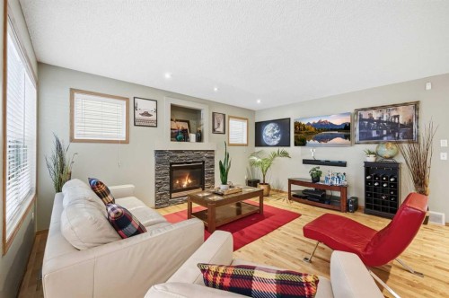 52 Panatella Gate, Calgary, AB - Indoor Photo Showing Living Room With Fireplace