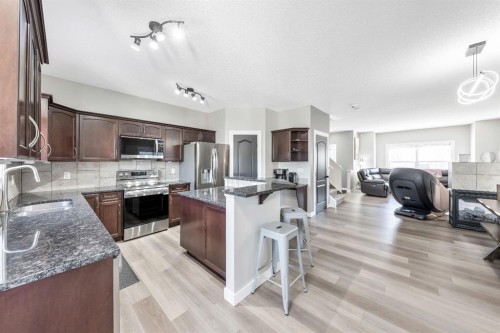 84 Cimarron Grove Close, Okotoks, AB - Indoor Photo Showing Kitchen With Stainless Steel Kitchen With Upgraded Kitchen