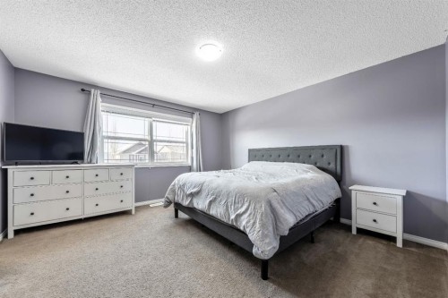 84 Cimarron Grove Close, Okotoks, AB - Indoor Photo Showing Bedroom
