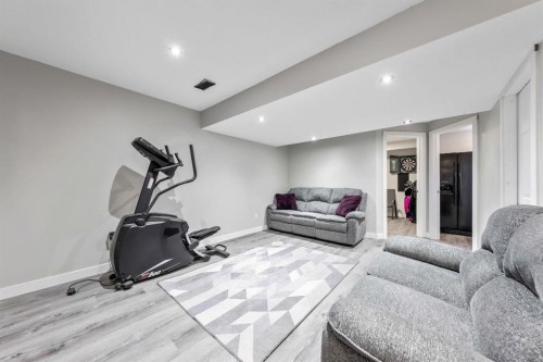 84 Cimarron Grove Close, Okotoks, AB - Indoor Photo Showing Gym Room