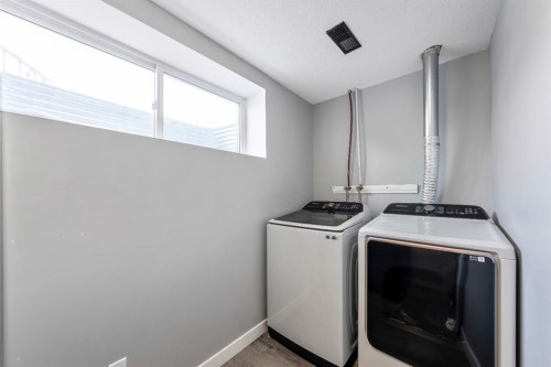 84 Cimarron Grove Close, Okotoks, AB - Indoor Photo Showing Laundry Room