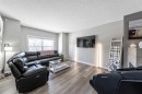 84 Cimarron Grove Close, Okotoks, AB  - Indoor Photo Showing Living Room 