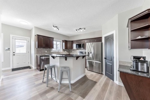 84 Cimarron Grove Close, Okotoks, AB - Indoor Photo Showing Kitchen With Stainless Steel Kitchen