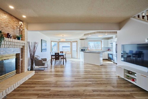 15 Hawkbury Close Nw, Calgary, AB - Indoor Photo Showing Living Room With Fireplace