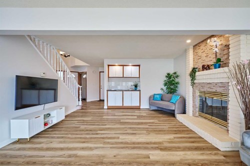 15 Hawkbury Close Nw, Calgary, AB - Indoor Photo Showing Other Room With Fireplace