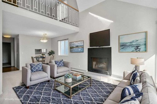 306-1720 13 Street Sw, Calgary, AB - Indoor Photo Showing Living Room With Fireplace