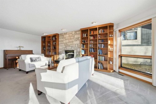 32 Woodgrove Crescent Sw, Calgary, AB - Indoor With Fireplace