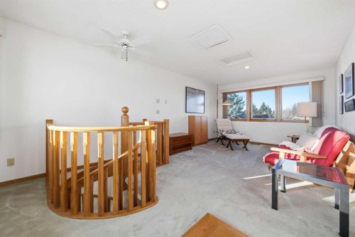 32 Woodgrove Crescent Sw, Calgary, AB - Indoor Photo Showing Other Room