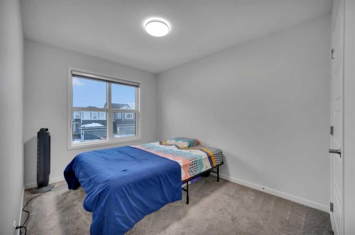 38 Seton Parade Se, Calgary, AB - Indoor Photo Showing Bedroom