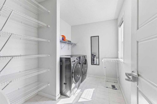 38 Seton Parade Se, Calgary, AB - Indoor Photo Showing Laundry Room