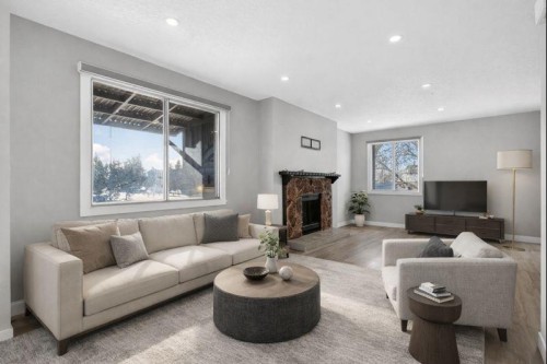 3304 56 Street Ne, Calgary, AB - Indoor Photo Showing Living Room With Fireplace