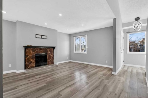 3304 56 Street Ne, Calgary, AB - Indoor Photo Showing Living Room With Fireplace