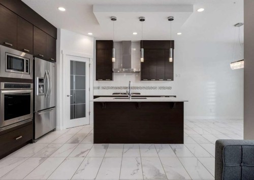 100 Cougar Ridge Close Sw, Calgary, AB - Indoor Photo Showing Kitchen With Stainless Steel Kitchen