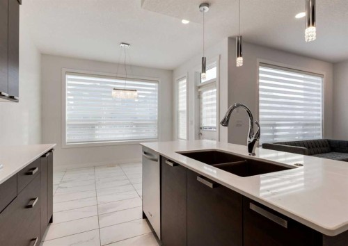 100 Cougar Ridge Close Sw, Calgary, AB - Indoor Photo Showing Kitchen With Double Sink With Upgraded Kitchen