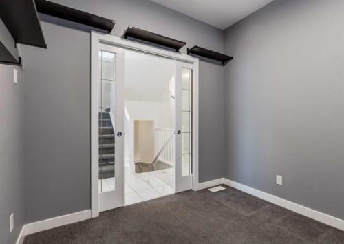 100 Cougar Ridge Close Sw, Calgary, AB - Indoor Photo Showing Other Room