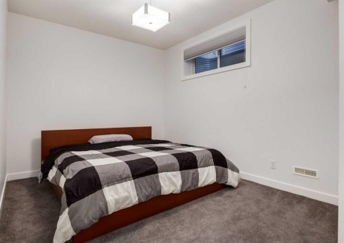 100 Cougar Ridge Close Sw, Calgary, AB - Indoor Photo Showing Bedroom