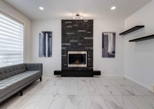 100 Cougar Ridge Close Sw, Calgary, AB - Indoor Photo Showing Other Room With Fireplace