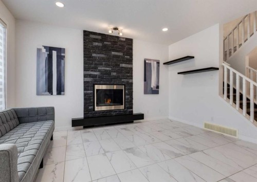 100 Cougar Ridge Close Sw, Calgary, AB - Indoor With Fireplace