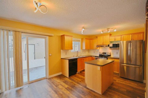 68 Covepark Close Ne, Calgary, AB - Indoor Photo Showing Kitchen With Double Sink
