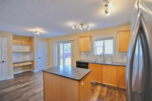 68 Covepark Close Ne, Calgary, AB - Indoor Photo Showing Kitchen With Double Sink