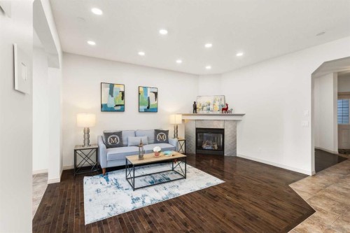 21 Panamount Row Nw, Calgary, AB - Indoor Photo Showing Living Room With Fireplace