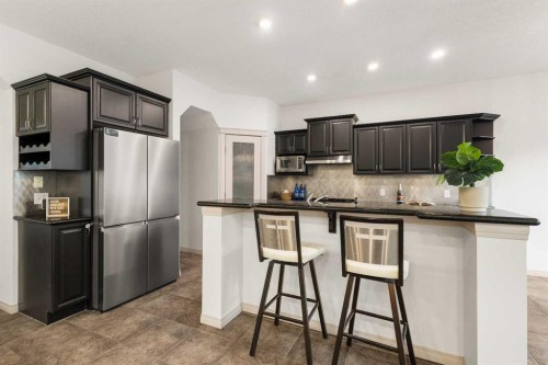 21 Panamount Row Nw, Calgary, AB - Indoor Photo Showing Kitchen With Upgraded Kitchen