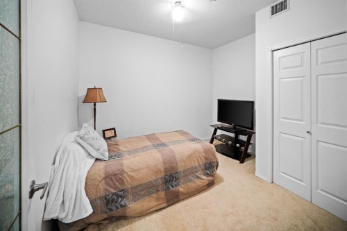 201-223 Tuscany Springs Boulevard Nw, Calgary, AB - Indoor Photo Showing Bedroom
